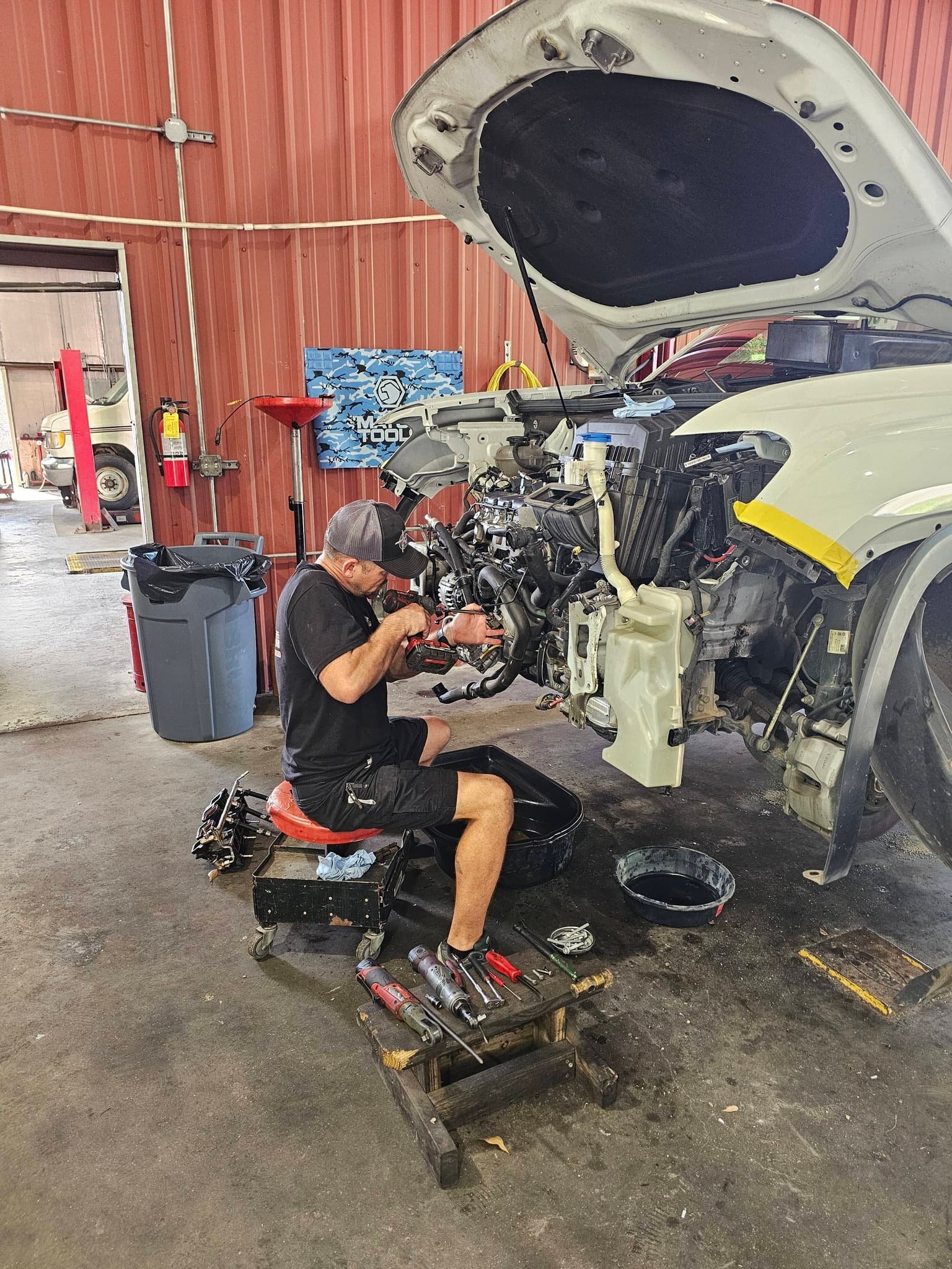 Mechanic performing engine repair at Archer's Automotive